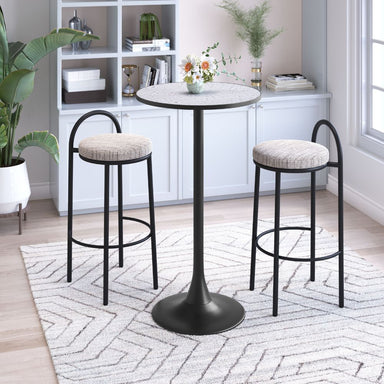 Round table with two bar stools in a room with a bookshelf and plants.