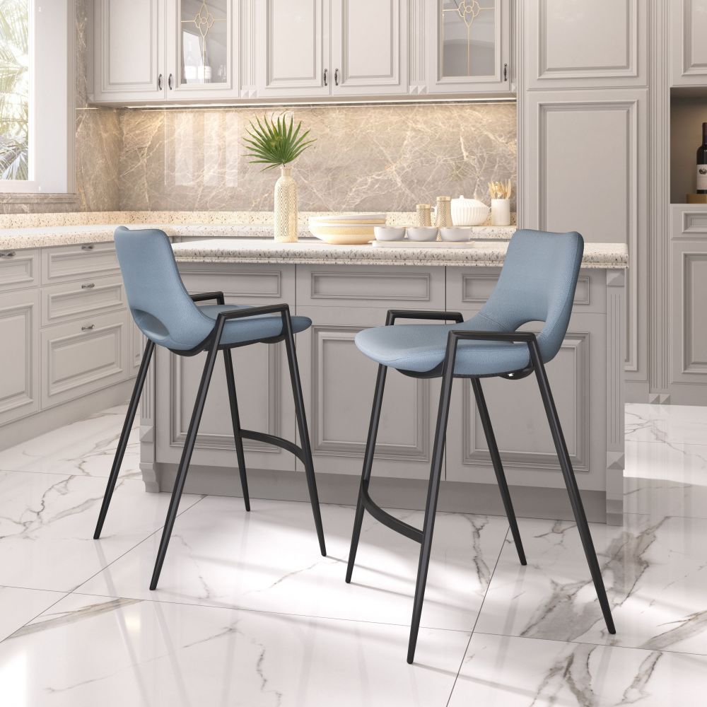 Two blue bar stools with black legs in a kitchen setting.
