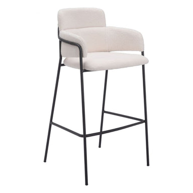 Bar stool with beige cushioned seat and backrest on a white background