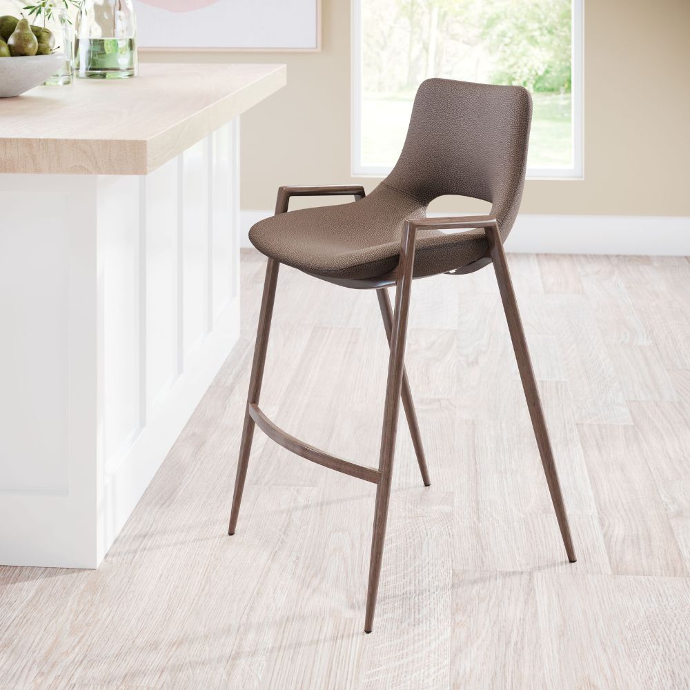 Brown bar stool in a modern kitchen setting with a white island and window in the background.