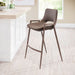 Brown bar stool in a modern kitchen setting with a white island and window in the background.