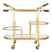 Gold serving cart with two shelves on a white background