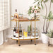 Gold bar cart with drinks and decor in a home setting