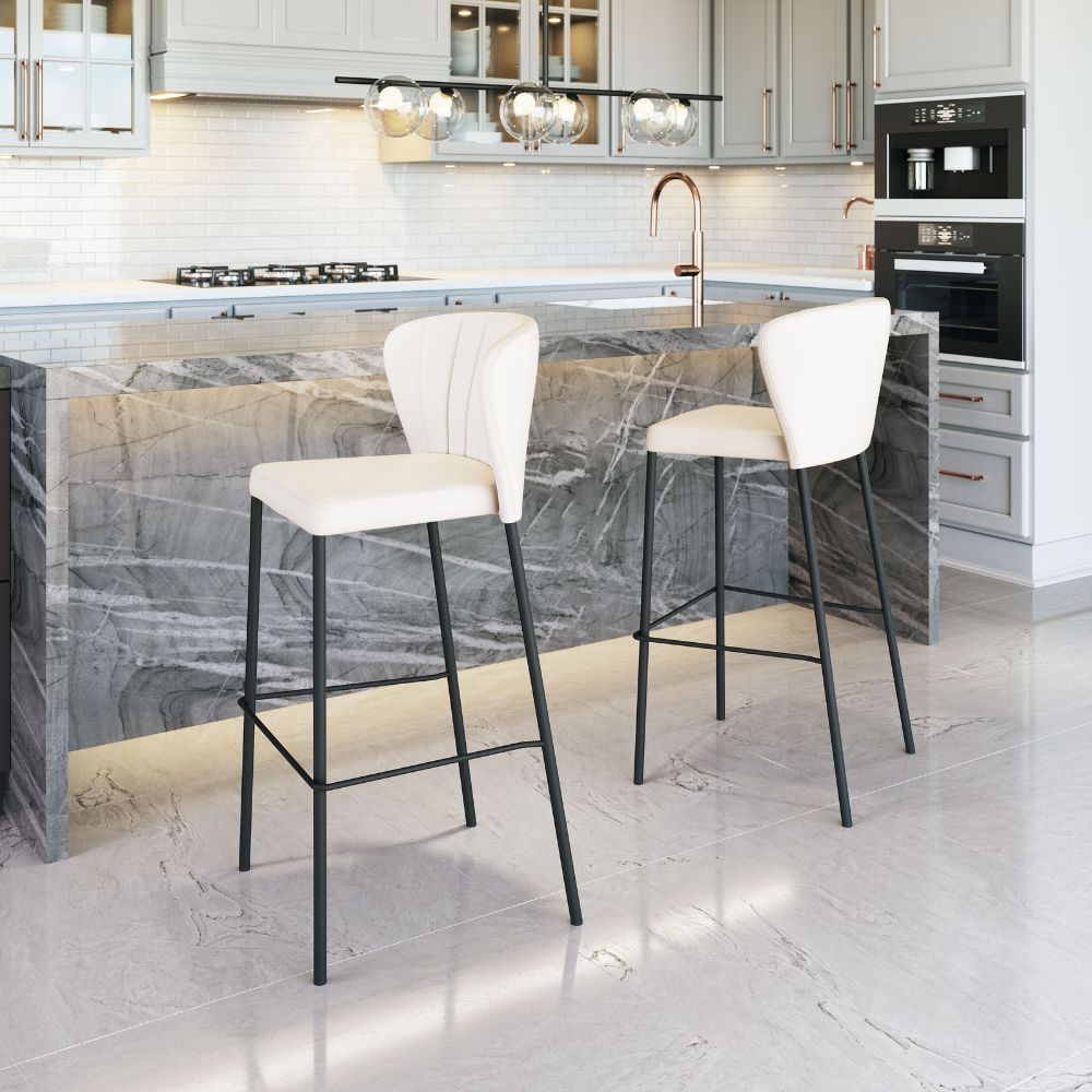 Modern kitchen with marble island and white bar stools