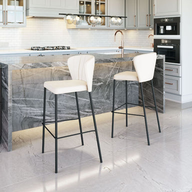 Modern kitchen with marble island and white bar stools