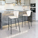 Modern kitchen with marble island and white bar stools