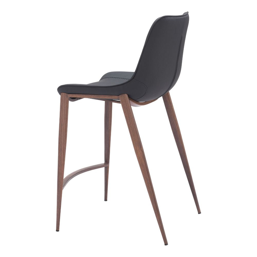 Bar stool with black seat and wooden legs on a white background