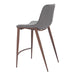 Bar stool with gray cushioned seat and wooden legs on a white background