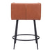 Brown leather bar stool with black metal legs on a white background