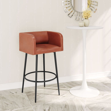 Brown bar stool in a room with a white table and decorative mirror.