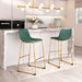 Two green bar stools with gold legs in a modern kitchen setting.