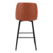 Bar stool with brown cushioned seat and black metal legs on a white background