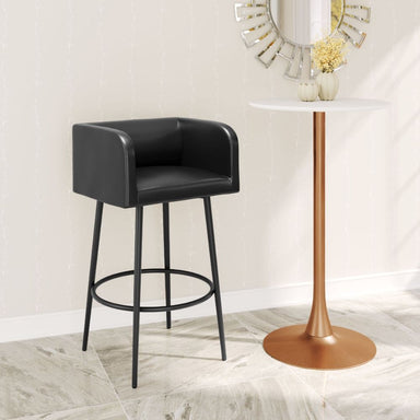 Black bar stool in a room with a round table and decorative mirror.