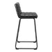 Black bar stool with quilted seat on a white background