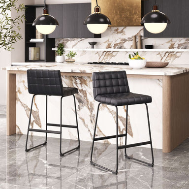 Modern kitchen with marble island, black bar stools, and pendant lights.