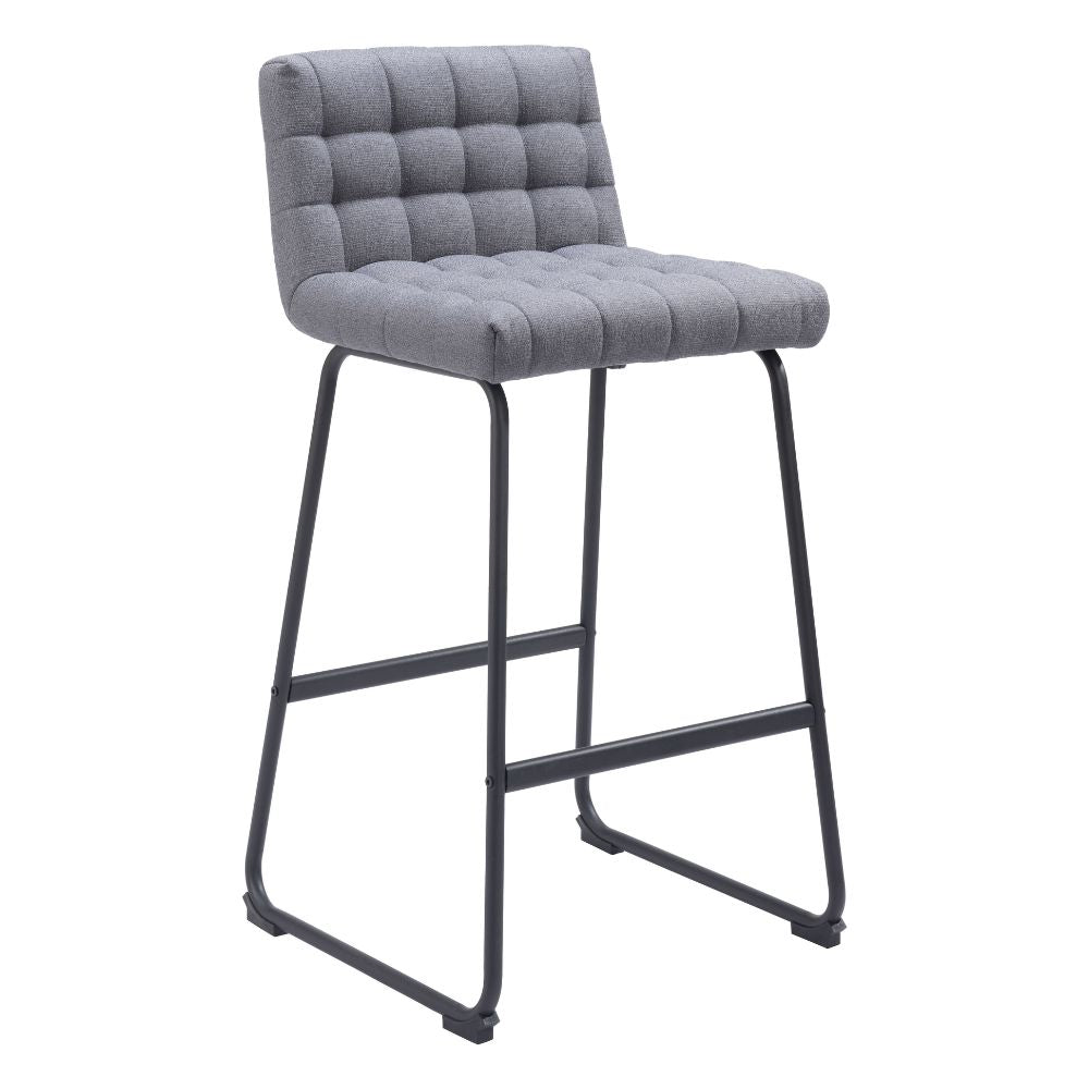 Gray bar stool with tufted seat on a white background