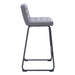 Gray bar stool with quilted seat on a white background