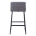 Gray bar stool with quilted backrest on a white background