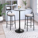 Round table with two bar stools in a room with a bookshelf and plants.