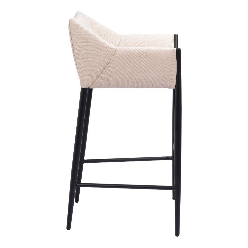 Bar stool with beige cushioned seat and black legs on a white background