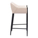 Bar stool with beige cushioned seat and black legs on a white background