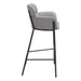 Gray bar stool with black metal legs on a white background