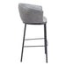 Gray bar stool with black metal legs on a white background