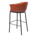 Brown leather bar stool with black metal legs on a white background