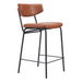 Bar stool with brown leather seat and backrest on a white background