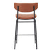 Brown leather bar stool with black metal legs on a white background