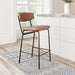 Brown bar stool with black metal frame in a kitchen setting