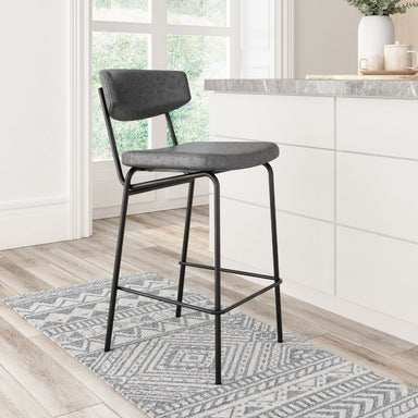 Gray bar stool with black metal frame in a kitchen setting