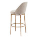 Bar stool with beige cushioned seat and gold metal frame on a white background