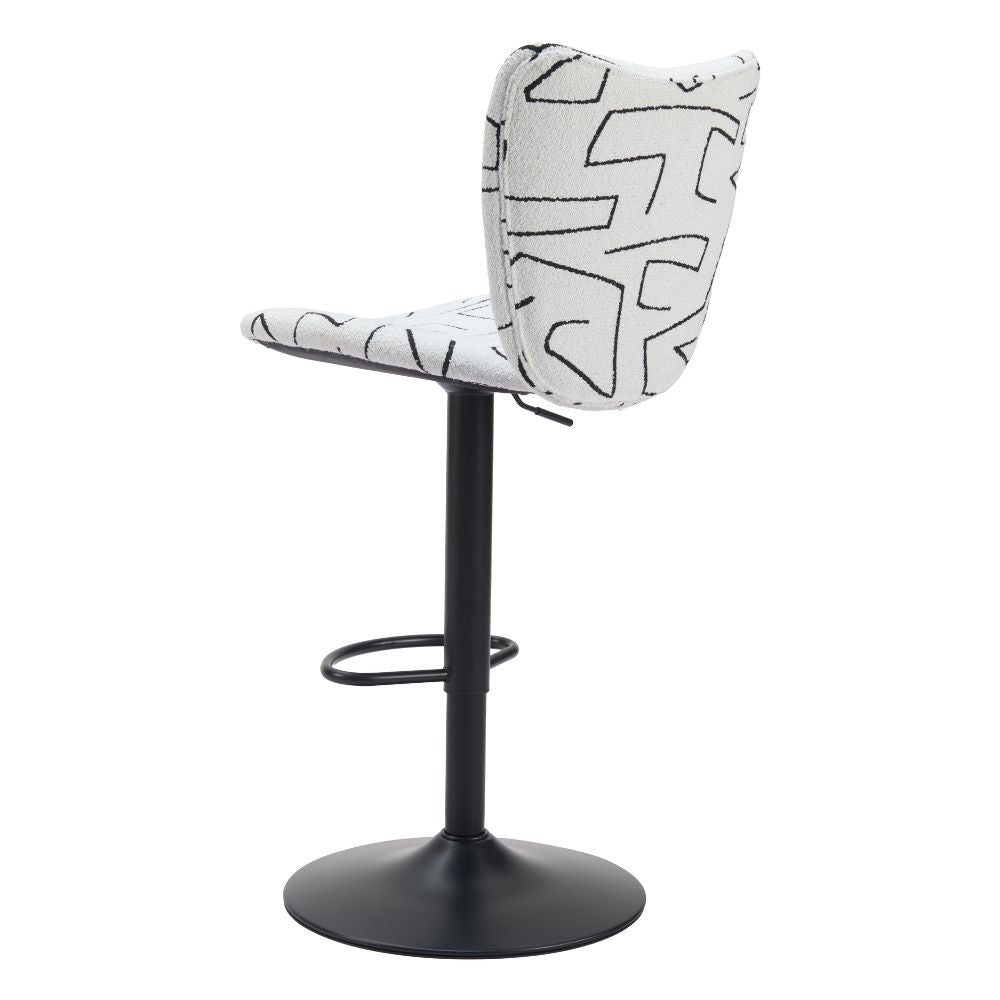 Bar stool with black and white patterned seat on a white background