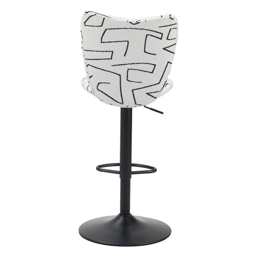 Bar stool with black and white patterned seat on a white background