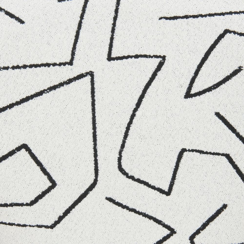 Close-up of a geometric pattern with black lines on a gray background