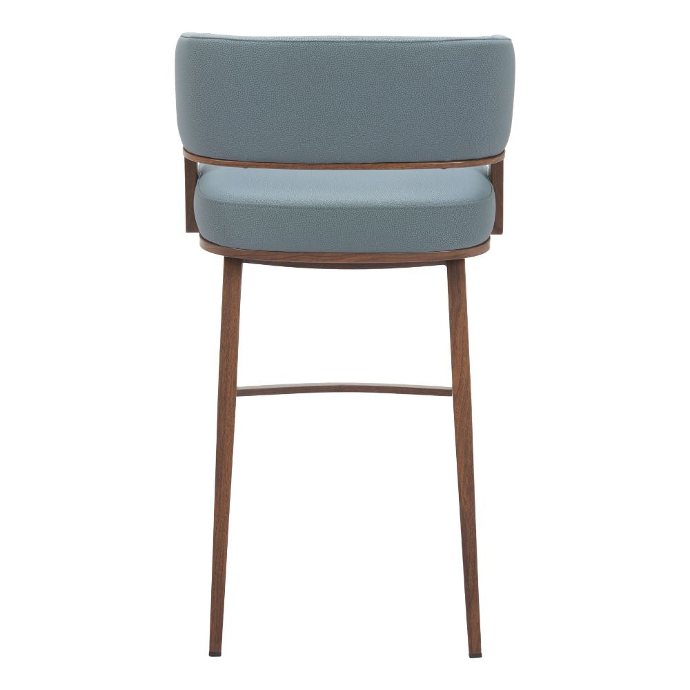 Bar stool with blue cushioned seat and backrest on a white background
