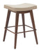 Wooden bar stool with a beige cushion on a white background