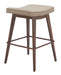 Wooden bar stool with a beige cushion on a white background