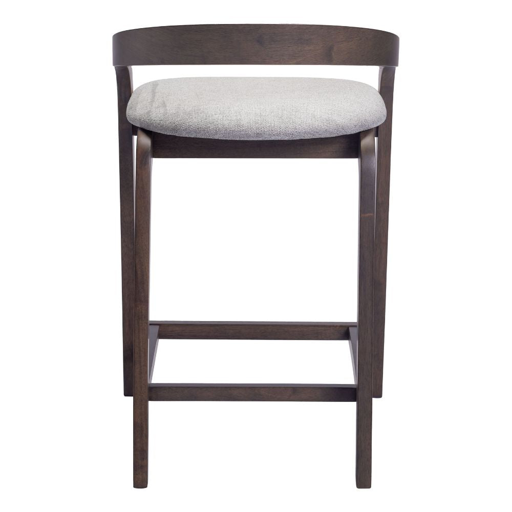 Wooden bar stool with a gray cushioned seat on a white background