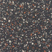 Patterned surface with multicolored chips on a dark background
