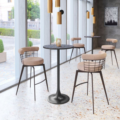 Modern bar stools with metal wire backrests and beige cushioned seats around a black table in a stylish interior setting.