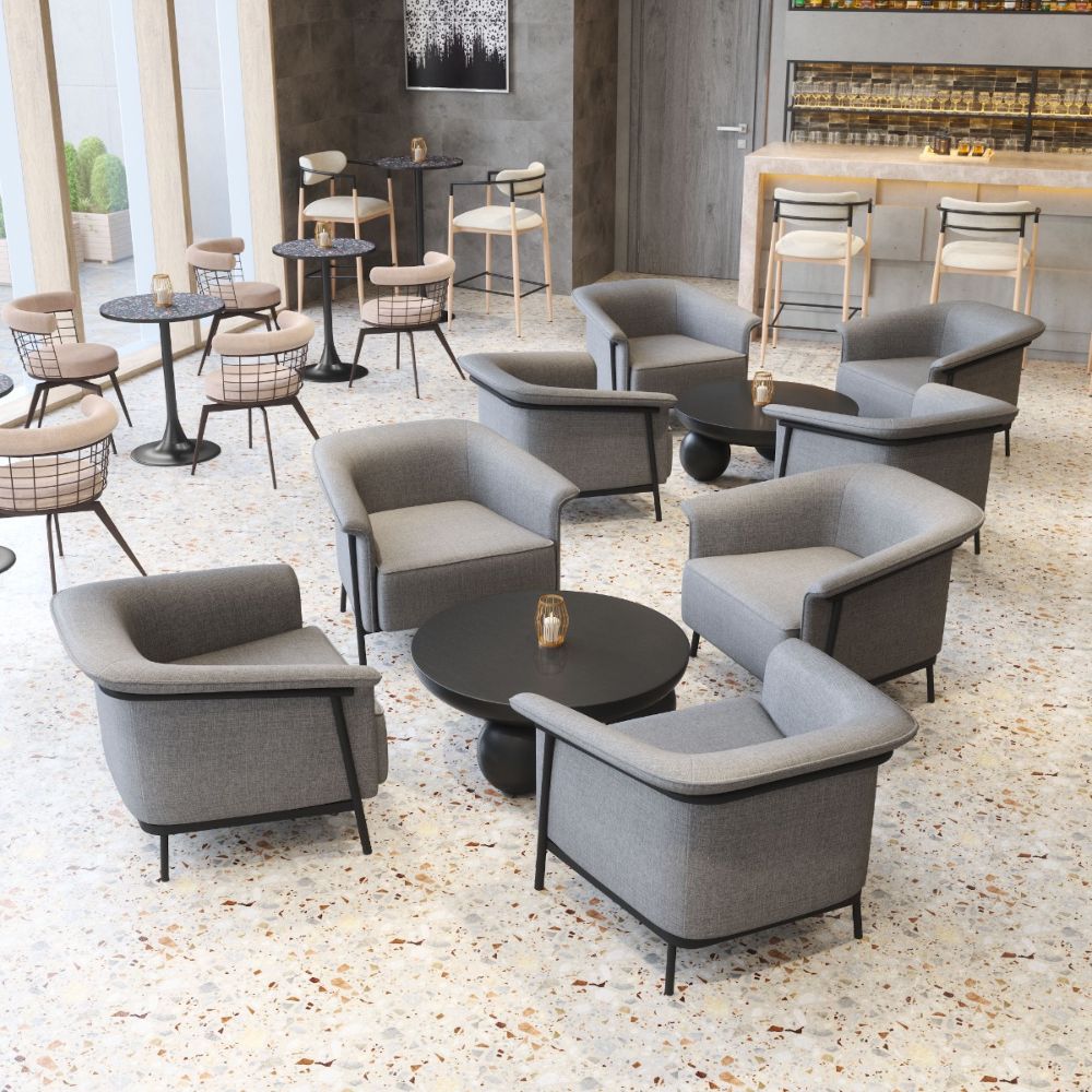 Modern gray chairs and tables arranged in a stylish indoor setting.