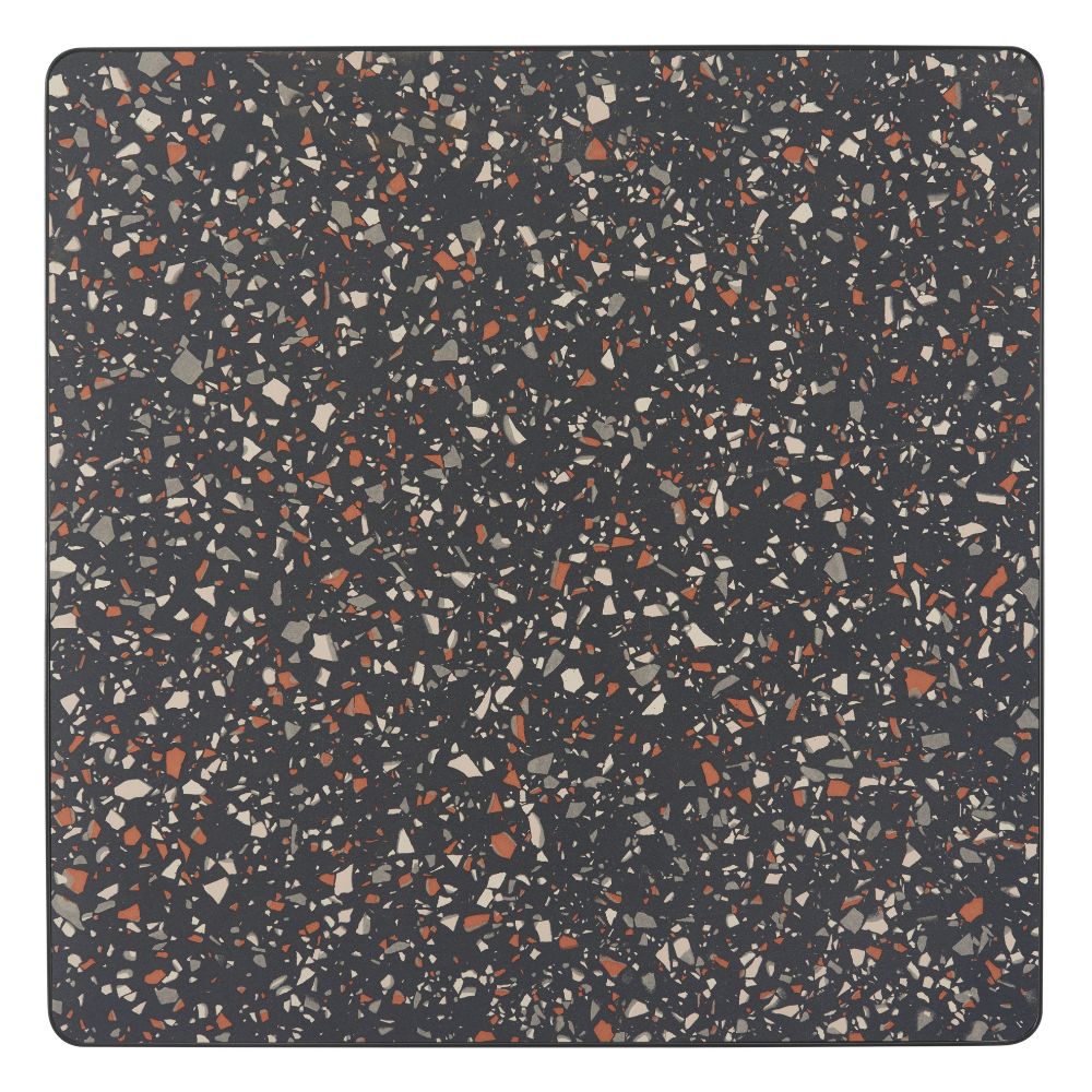 Square mat with a speckled pattern on a dark background
