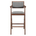 Wooden bar chair with gray cushioned seat and backrest on a white background