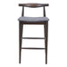 Bar stool with wooden frame and gray cushioned seat on a white background
