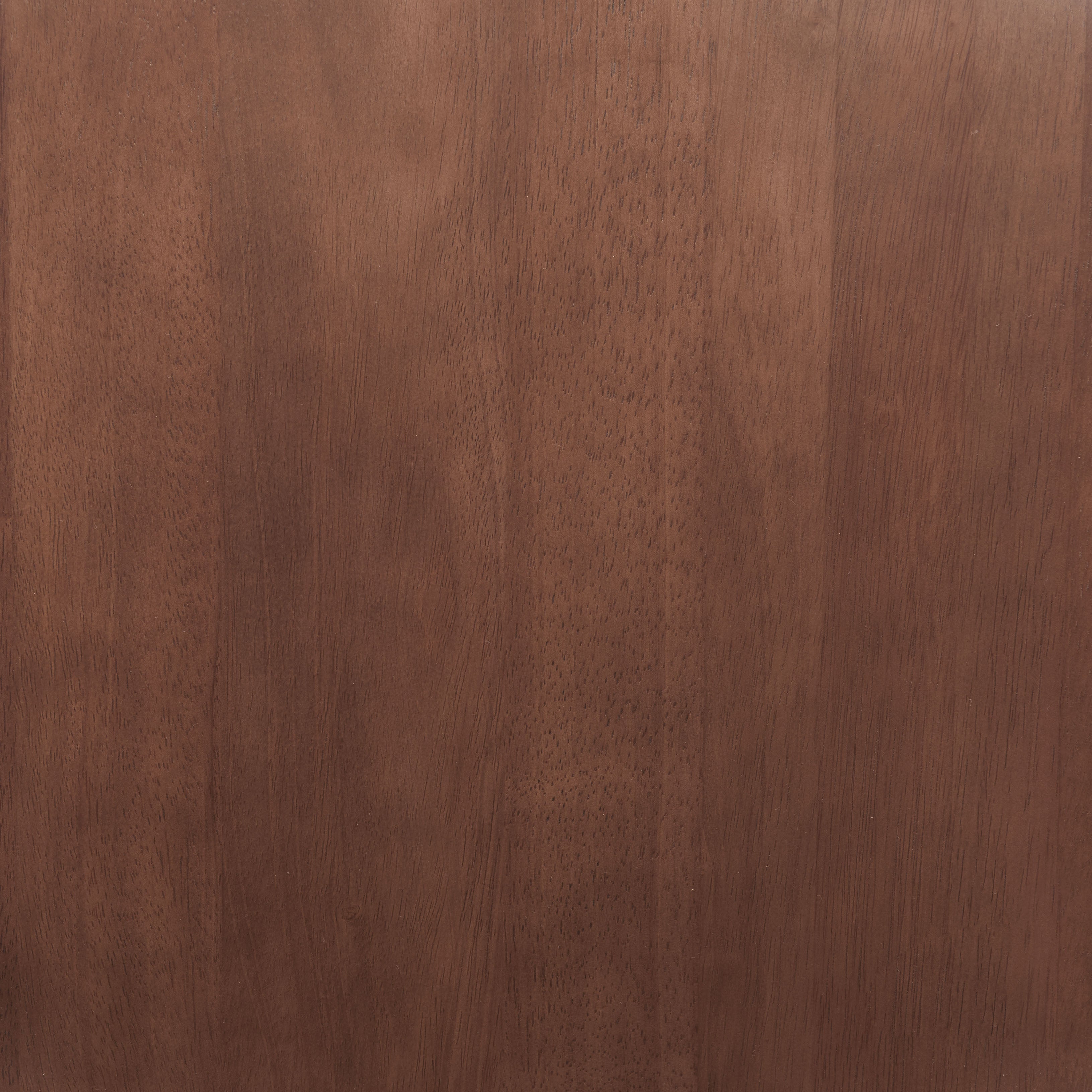 Close-up of a wooden surface with a rich brown color and visible grain pattern.