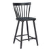 Black wooden bar stool with slatted backrest on a white background