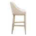 Bar stool with beige cushioned seat and wooden legs on a white background