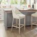 Kitchen island with bar stools in a bright, modern kitchen.